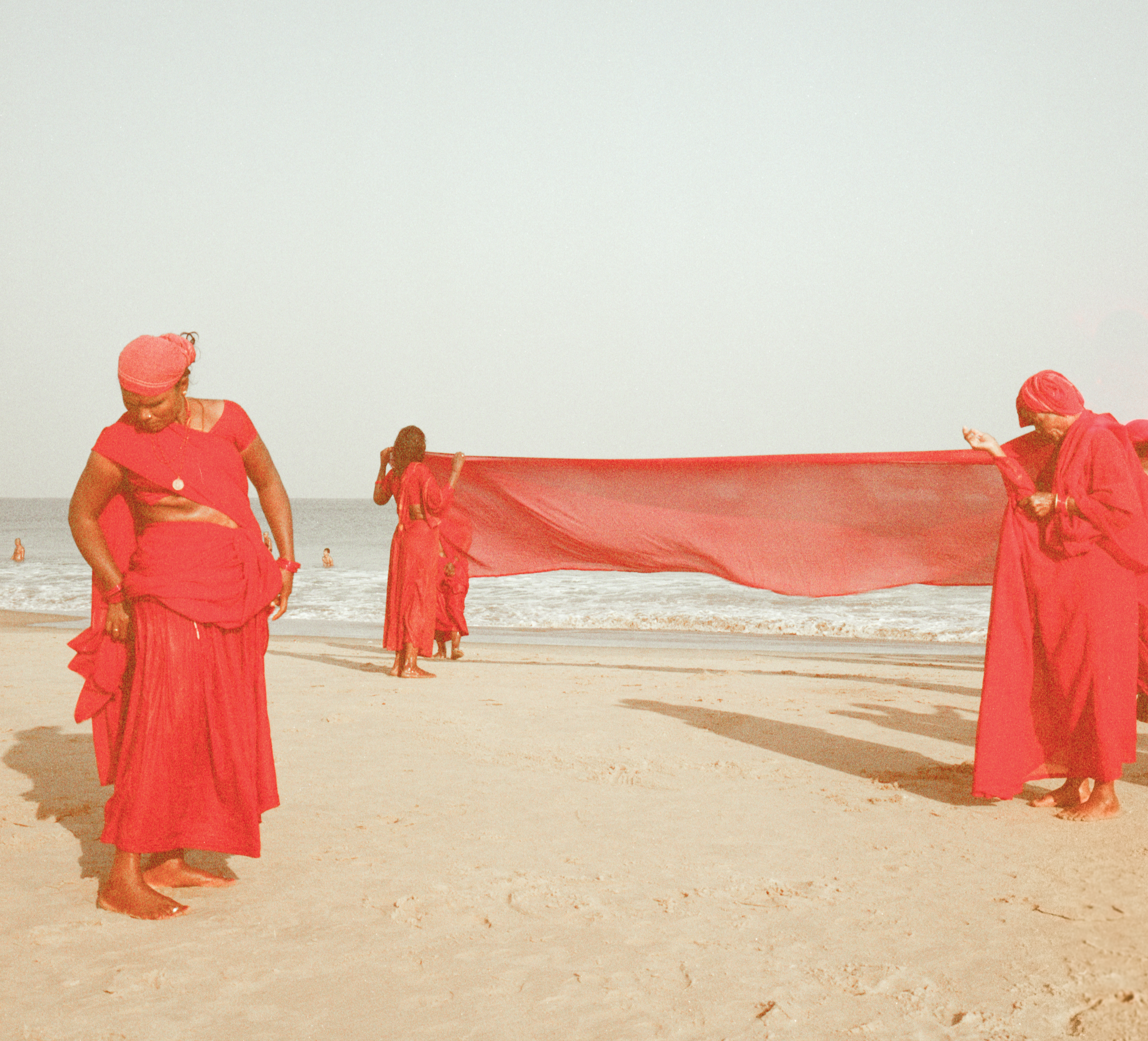 Three women on the shoreline, Gokarna, India 2018