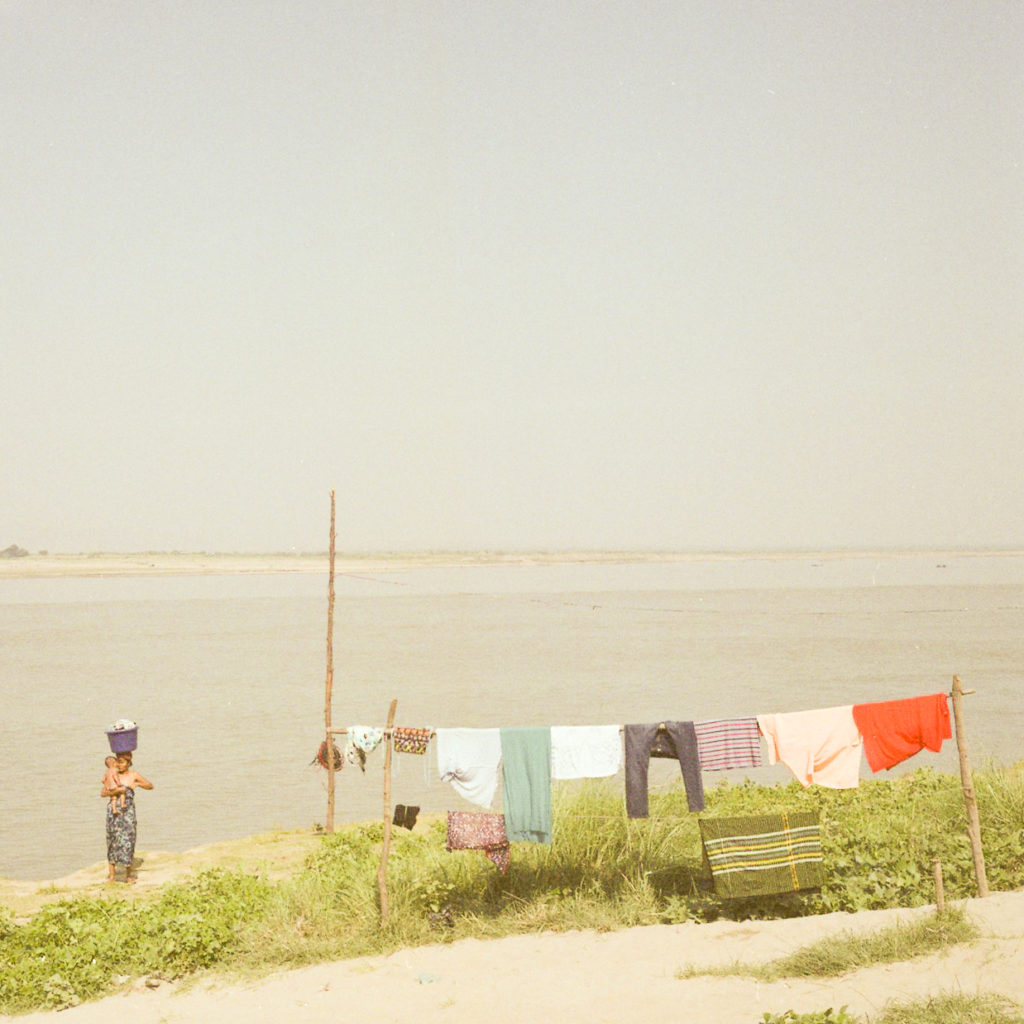 Mother doing laundry, Bagan, Myanmar — Asia 2010–2020, fine art photograph by Raffaele Ferrari