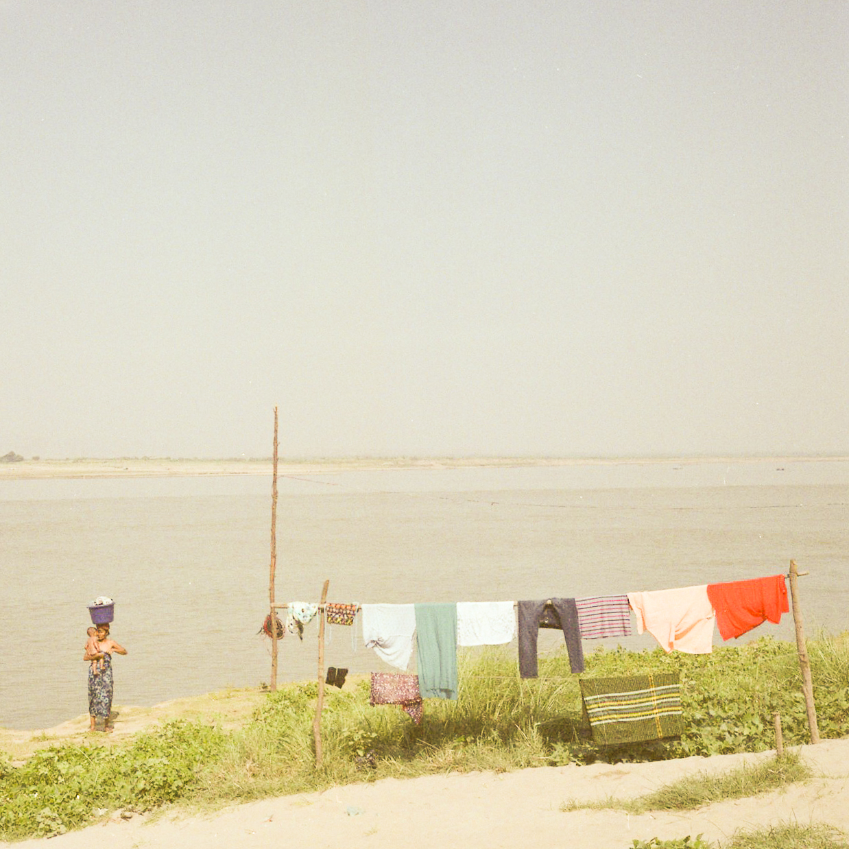 mother make laundry in Bagan, fine art photography , travel photography, shooting film, medium format, Myanmar, Burma,raffaele ferrari, rolleiflex, fujifilm